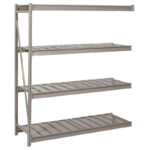 A metal shelving unit with four tiers is shown. The shelves have a slatted design and are supported by a vertical frame on the left. The unit is freestanding and is designed for storage purposes.