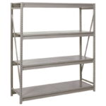 A large, empty metal shelving unit with four levels, featuring adjustable perforated beams and supports. The structure is painted gray and set against a plain white background.