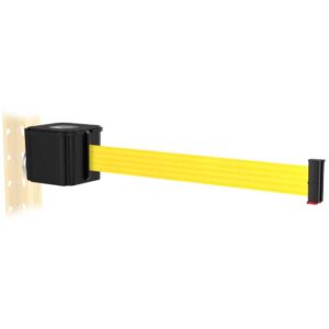 A yellow retractable barrier tape extends from a black wall-mounted unit, attached to a light-colored wooden surface with evenly spaced holes. The end of the tape has a black and red tip.