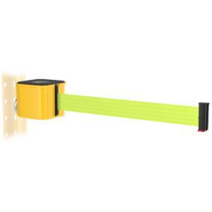 A retractable safety barrier with a bright yellow and black design is mounted on a perforated wall. The belt is extended and is neon green with a black end cap.
