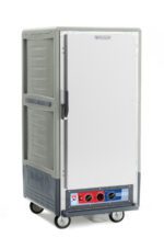 The Metro C537-MXFS-L-GY C5 3/4 Height Insulated Moisture Heated Holding/Proofing Cabinet has a gray body with a full-length solid door, featuring lip load aluminum slides, two temperature knobs, and four wheels. Operating at 220-240V and 50/60Hz for efficient heating, it subtly showcases its brand.