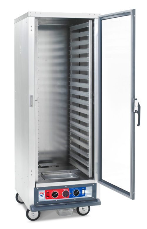 The Metro C519-CFC-LA C5 1 Series Holding/Proofing Cabinet, full height with lip load aluminum slides, has a transparent door, multiple shelves, bottom control dials, and runs on 120V/2000W. It features four wheels for easy mobility.