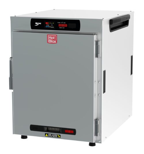 The Metro HBCW8-DS-CT HotBlox is a silver, rectangular warming cabinet with a digital touchscreen on top and the Hot Blox logo. It operates at 120V, 60Hz, 875W, includes a side handle, and fits stylishly on any flat surface.