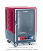 The Metro C535-MXFC-LA C5 3 Series is a red and gray commercial food warmer with a full-length clear door, featuring Lip Load Aluminum Slides. It operates at 220-240V, with control knobs at the bottom and four wheels for mobility.