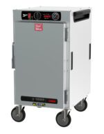 The Metro HBCN8-AS-M HotBlox Narrow 8-Pan Cabinet features a silver design with wheels, analog controller, 875W power capacity, clear temperature gauge, top ventilation panel, and Hot Blox logo on the solid door. Powered at 120V, 60Hz with NEMA 5-15P plug.