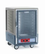 The Metro C535-HFC-4-GYA C5 3 Series Insulated Holding Cabinet is a gray, wheel-mounted unit with a full-length clear door. It features Fixed Wire Slides, control dials on a red bottom panel, and a convenient side handle. The cabinet operates at 120V and 2000W.