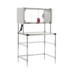 The Metro EZHSE36W-KIT Super Erecta Hot Workstation features a metal wire shelving unit with an enclosed stainless steel heated shelf, two red arm ports, a clear front panel, and an electrical cord on the left side. It measures 24 x 36 x 64, operates on 120V, and has a power of 400W.