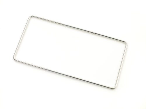 Displayed on a plain white background, a silver, rectangular metal frame resembles the minimalist elegance of the Metro MS-RING PrepMate Magic Ring. With thin rounded corners, it appears crafted for a license plate, exuding simplicity and style.