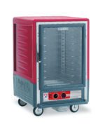 The Metro C535-HFC-U C5 3 Series is a red, 1/2 height insulated holding cabinet on wheels with universal wire slides, a full-length clear door with handle, bottom control knobs, and operates efficiently at 120V, 60Hz.