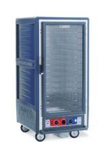 The Metro C537-CXFC-4-BU C5 3 Series Insulated Holding/Proofing Cabinet features a full-length clear door, fixed wire slides, and wheels for mobility. It has a bottom control panel with red/blue knobs for temperature adjustment, operates at 220-240V and 50/60Hz, and boasts a dark blue exterior.