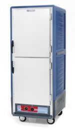 The Metro C539-HDS-L-BU is a full-height insulated holding cabinet with Dutch solid doors, lip load aluminum slides, black handles, and wheels. It includes a bottom control panel with dials and the Metro logo and operates efficiently at 120V, 60Hz. The cabinet is blue and gray.
