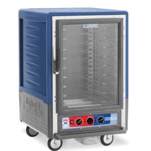 The Metro C535-MFC-U-BU is a blue 1/2 height insulated food warming cabinet on wheels with a full-length clear door, universal wire slides, and control knobs with temperature indicators on the 120V front panel.