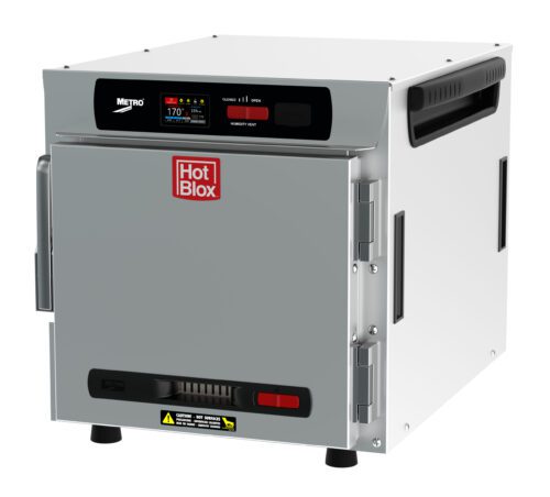 The Metro HBCN4-DS-CT HotBlox is a silver, box-shaped, narrow 4-pan insulated countertop/stacking holding cabinet with a solid door and side vents. It features a digital touchscreen controller at the top and uses a NEMA 5-15P plug.