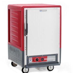 The Metro C535-HFS-L C5 3 Series is a red insulated food transport cart featuring a white full-length solid door, gray sides, four wheels, a left-side handle, bottom front panel control knobs with a digital display, and lip load aluminum slides for versatile shelving.