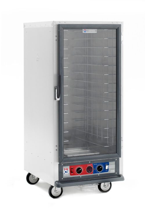 The Metro C517-CFC-4A C5 1 Series, a tall silver holding/proofing cabinet with a transparent front door and multiple shelves, features fixed wire slides for easy access and red/blue control panels at the bottom. It operates on 120V, 60Hz.