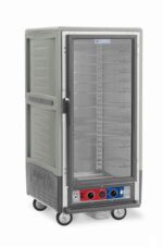 The Metro C537-CLFC-U-GYA C5 3 Series 3/4 height insulated holding/proofing cabinet features a full-length clear door, universal wire slides, control knobs at the bottom, is powered by 120V, has wheels for mobility, and comes in a sleek gray design perfect for keeping food warm on the go.