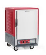 The Metro C535-HFS-UA C5 3 Series Insulated Holding Cabinet is a stylish 1/2 height unit on wheels with a solid door. Featuring red and gray design, control panel at the bottom, powered by 120V, it includes universal wire slides, a side handle, and branding on the lower left for a modern look.