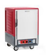 The Metro C535-CXFS-UA C5 3 Series is a 1/2 height red holding/proofing cabinet with a stainless steel solid door featuring a left-hand handle. It has a digital display, control knobs, Universal Wire Slides, and textured side design; operates at 220-240V, 1681-2000W.