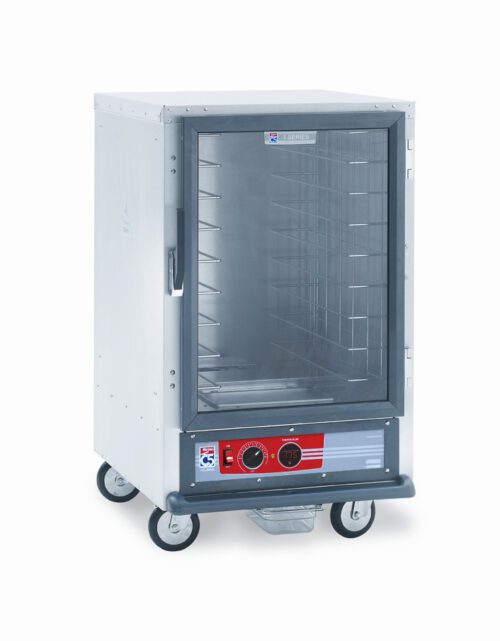 The Metro C515-HFC-4A C5 1 Series is a 2000W, 120V, half-height holding cabinet featuring a glass door, metal exterior, and four caster wheels. It includes fixed wire slides with multiple shelves and has a bottom control panel with temperature dial and digital display.