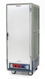 The full-height Metro C539-CFS-L-GY C5 3 Series Insulated Holding/Proofing Cabinet, operating at 120V and 60Hz, features a full-length solid gray door and lip load aluminum slides, standing on four wheels with control knobs on the lower front panel.