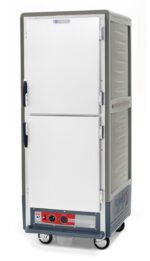 The Metro C539-HDS-U-GYA is a full-height, grey insulated holding cabinet with Dutch solid doors and universal wire slides, powered by 120V. It features handles, vented sides, and a control panel with dials and switches at the bottom.