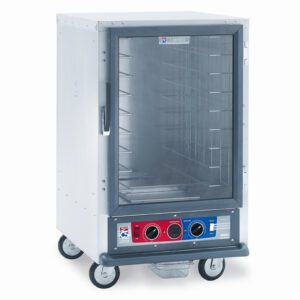 The Metro C515-CXFC-L C5 1 Series is a stainless steel, half-height holding/proofing cabinet with aluminum slides, equipped with a clear front door and bottom red-blue control panel featuring two dials. It is mounted on wheels and operates at 220-240V, 1681-2000W, and 50/60Hz.