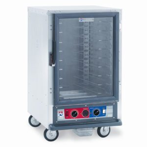The Metro C515-CXFC-U C5 1 Series Cabinet is a half-height stainless steel food warmer with a transparent door showing multiple shelves. It features control knobs and indicators on the front panel, operates at 220-240V, and is equipped with four wheels for easy mobility.