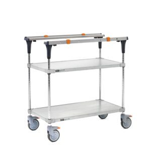 The silver metal utility cart with three gray shelves and orange accents features solid galvanized top and bottom shelves with chrome posts. It includes four swiveling wheels, folds easily, and has handles on both ends, mirroring the minimalistic design of the Metro MS1836-FGFG PrepMate MultiStation 36 Prep Station.