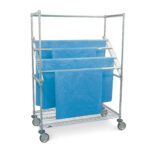 The Metro SWR556DC Super Erecta High-Profile Sterile Wrap Rack features a wire bottom shelf and measures 24 x 48. Its a metal cart with four wheels and horizontal rods for holding fabric or non-woven blue surgical drapes.