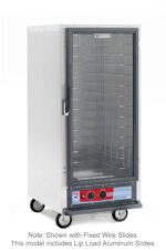 The Metro C517-HFC-LA C5 1 Series is a 3/4 height, silver food warming cabinet on wheels with a clear glass door, multiple wire shelves, and a bottom control panel. It has lip load aluminum slides and operates at 120V and 60Hz.