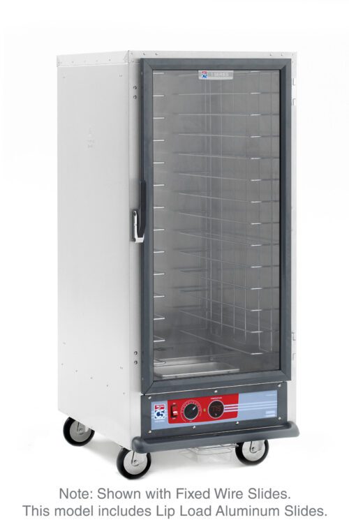 The Metro C517-HFC-LA C5 1 Series is a 3/4 height, silver food warming cabinet on wheels with a clear glass door, multiple wire shelves, and a bottom control panel. It has lip load aluminum slides and operates at 120V and 60Hz.