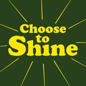 A dark green graphic features Choose to Shine in bold yellow, mimicking the Justrite Mat, 195 Choose To Shine 3X5 Gn design. Light rays radiate from the text, creating a sunburst effect.