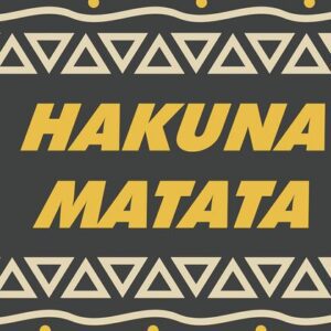 The image depicts the Justrite Mat, version 195 Hakuna Matata 3X5 Ch, featuring bold yellow letters on a dark background with triangular patterns and light-colored circles.