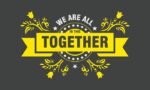 On a dark gray background, We Are All in This Together stands out in white and yellow, accented by yellow floral designs inspired by the Justrite Mat, infusing the scene with an uplifting and collaborative spirit.