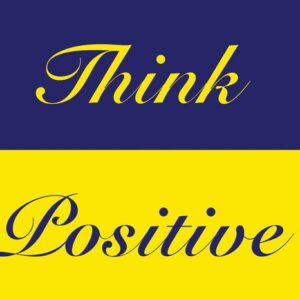 The image features the Justrite Mat,195 Think Positive 4X6 Bu design with Think in yellow on a blue background and Positive in blue on yellow, both in elegant cursive. This mat exudes optimism, making it ideal for brightening any space.