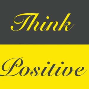 The Justrite Mat,195 Think Positive 4X6 Ch features Think Positive text, with Think in yellow cursive on a dark gray background and Positive in dark gray on a bright yellow surface, bringing positive vibes to any space.