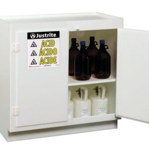 The Justrite Cabinet Acd, Poly Standing, Wh is opened, showcasing shelves with brown bottles and white containers. A label on the door reads Justrite Acid Ácido Acide with warning symbols for safe hazardous material storage.