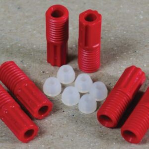 Red, threaded plastic anchors and small white caps from the Justrite 3.0 Mm Tubing Connector Set are neatly arranged on a textured surface with six red anchors and eight white caps evenly spaced.