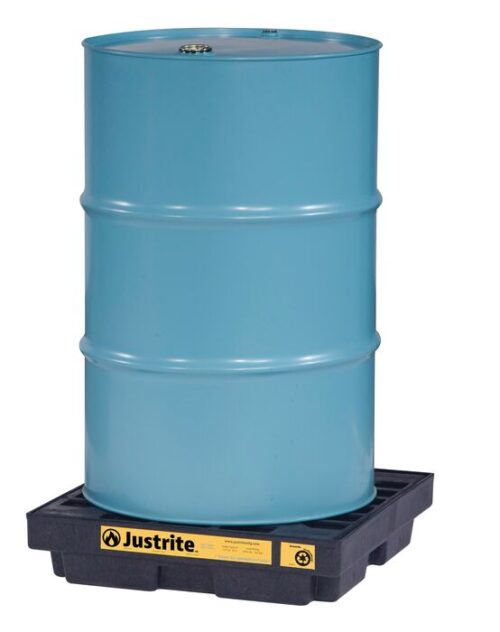 A blue metal drum rests on a Justrite Accum Ctr, 1 Drum, Ecopoly Blk spill containment pallet with a yellow label.