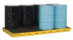 The Justrite Accum Ctr, 8 Drum, Ecopoly Yel pallet accommodates eight metal drums—four black and four light blue—neatly arranged with four in front and four in back. Its grid-like plastic surface enhances its sturdy design.