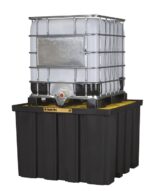 A large white industrial container with a metal frame sits on a Justrite Pallet, Ibc Indoor, Ecopoly black spill containment pallet, featuring a visible nozzle at the bottom.
