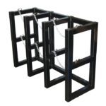 Introducing the Justrite Gcyl Barricade Rack,3X1: a black metal bike rack with three rectangular sections reinforced by chains for security, combining modern elegance and safety.
