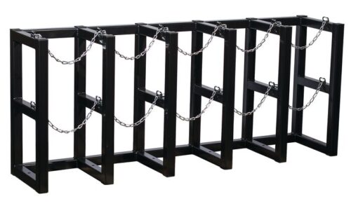 The Justrite Gcyl Barricade Rack,5X1 is a stylish black metal bike rack with a zigzag design and features chains between vertical bars to securely anchor multiple bicycles, making it perfect for outdoor use.