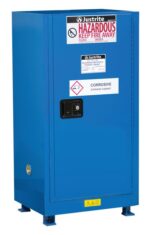 A sleek blue Justrite Cab, Bshock, Hazmat Cmp 15G Sc storage unit features HAZARDOUS KEEP FIRE AWAY and CORROSIVE STORAGE CABINET labels, a black handle, and lower section safety warnings for increased protection.