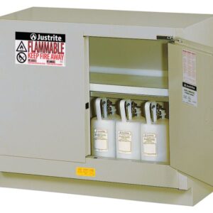 The Justrite Cabinet Fmhd 31G/48 Sc Slv, featuring a beige exterior with bold Flammable and Keep Fire Away warnings, showcases three white safety canisters inside, highlighting its meticulous design for safety in hazardous environments.