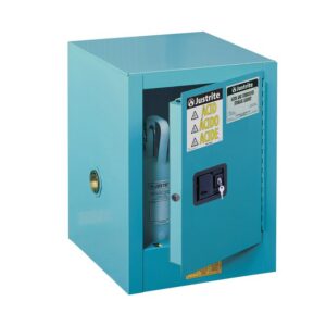 The Justrite Cabinet, Acid Ctop 4G, in Man Blu showcases a partially open door for hazardous material storage, marked with warning labels. A lock is on the handle, and a vent hole is visible on the side.