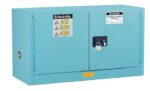 The Justrite Cabinet, Acid Pigy 17G, Mn Blu is a blue metal safety cabinet with dual doors labeled ACID in multiple languages. It features a secure lock and safety warnings with the Justrite brand prominently displayed on the top left.