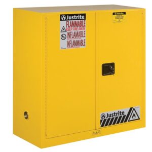 The Justrite Cabinet, Flam Sfty 30G Man Yel, is a yellow flammable storage unit with two doors, featuring clear Flammable and Keep Fire Away warning labels and a black handle on the right door for easy access.