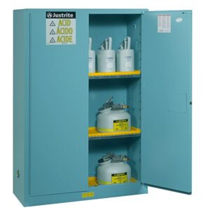 The Justrite Cabinet, Acid Sfty 45G Man Blu, in vibrant blue, stands open to reveal three shelves with six containers labeled for safety or acid. Prominent safety warning labels on its door ensure secure storage.