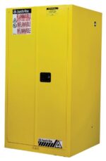 The Justrite Cabinet, Flam Sfty 60G Man Yel, features a black handle and clear warning labels, designed for safely storing inflammable materials.